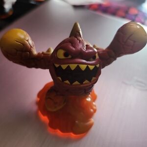 Red and Orange Action Figure with Flame-Like Features